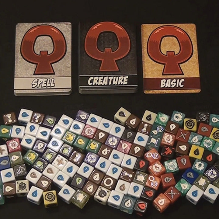 Quarriors! Dice Building Game spell and creature cards with dice