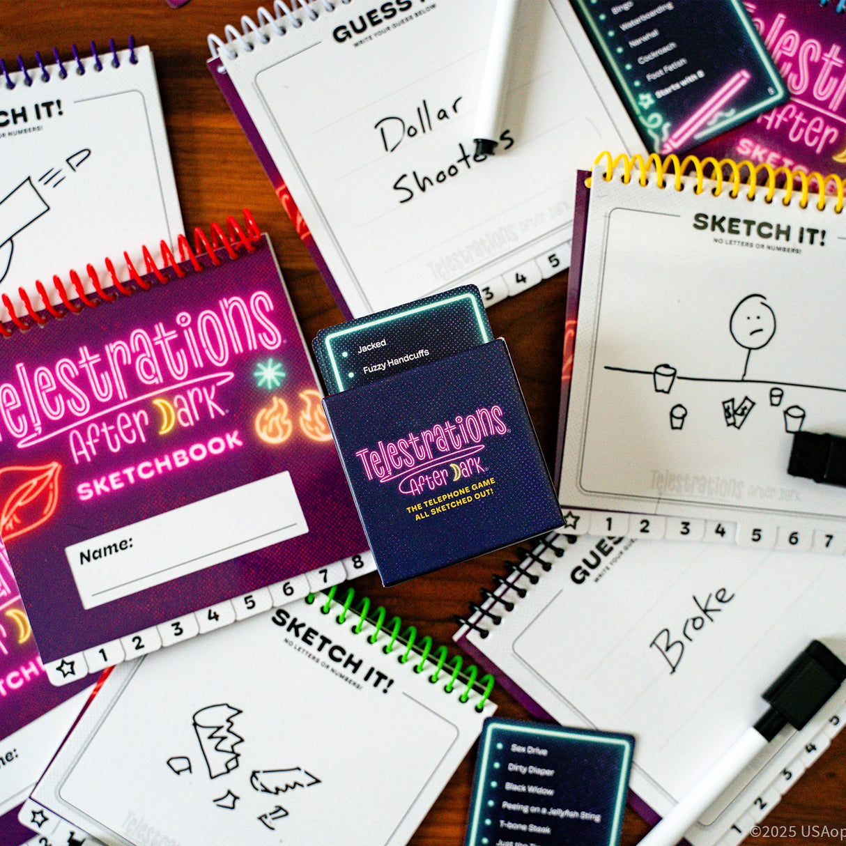 Telestrations After Dark 8 Player (2nd Edition) board game components with sketch pads and markers