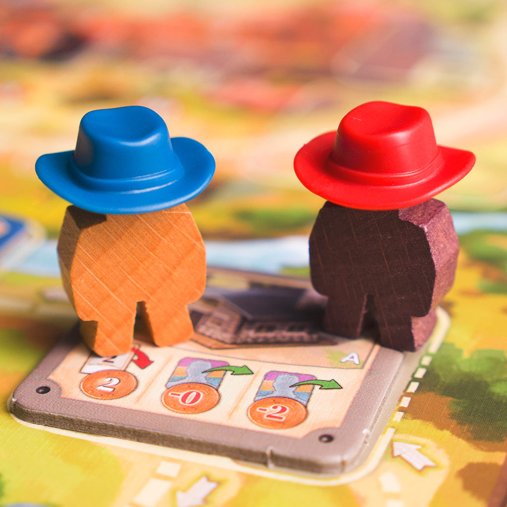 Great Western Trail game components and cowboy meeples