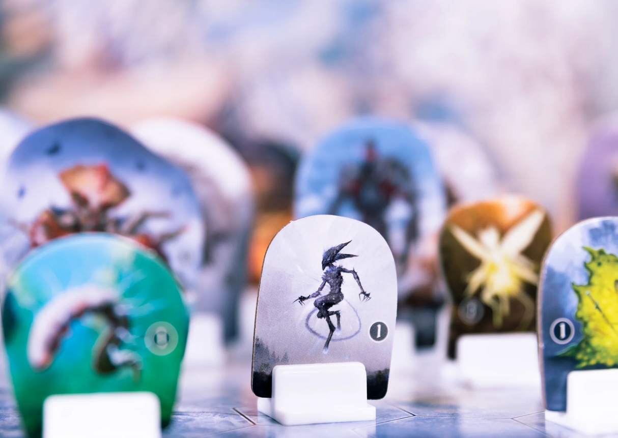 Frosthaven game board with hexagonal tiles and standees