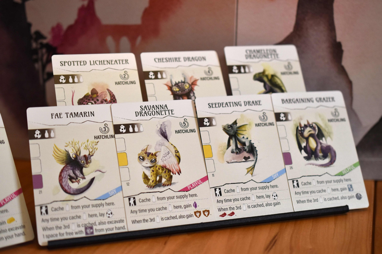 Wyrmspan player board and baby dragons