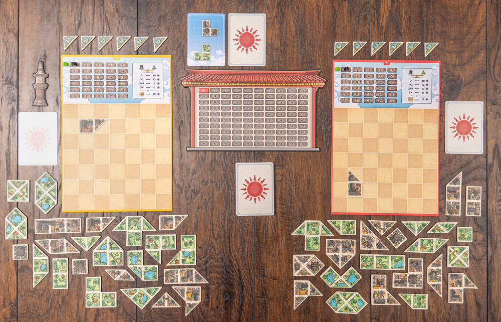 Tangram City board game puzzle pieces and city building