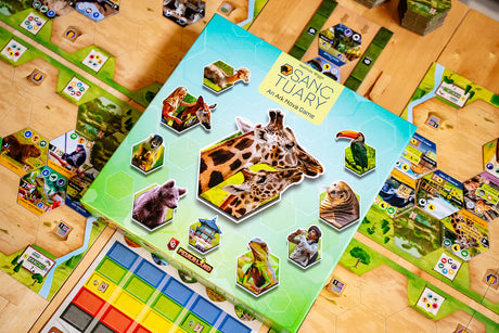Board game with animal-themed cards on a wooden table